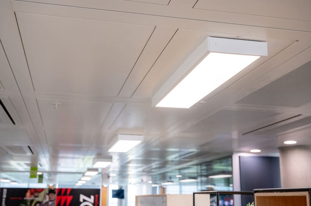 Modern suspended LED lighting installed in a commercial office ceiling